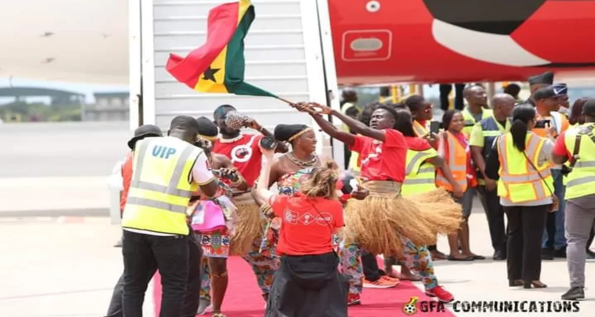 Samuel M.Marquaye a.k.a Bukom Mama Leads cultural dancers to welcome FIFA World Cup trophy at the Kotoka International Airport.