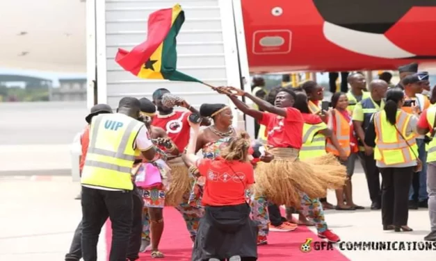 Samuel M.Marquaye a.k.a Bukom Mama Leads cultural dancers to welcome FIFA World Cup trophy at the Kotoka International Airport.